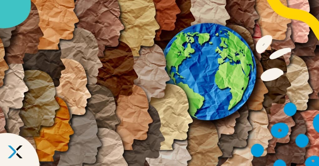 Papercraft displaying multiple human faces and the earth, to symbolize diversity and inclusion.