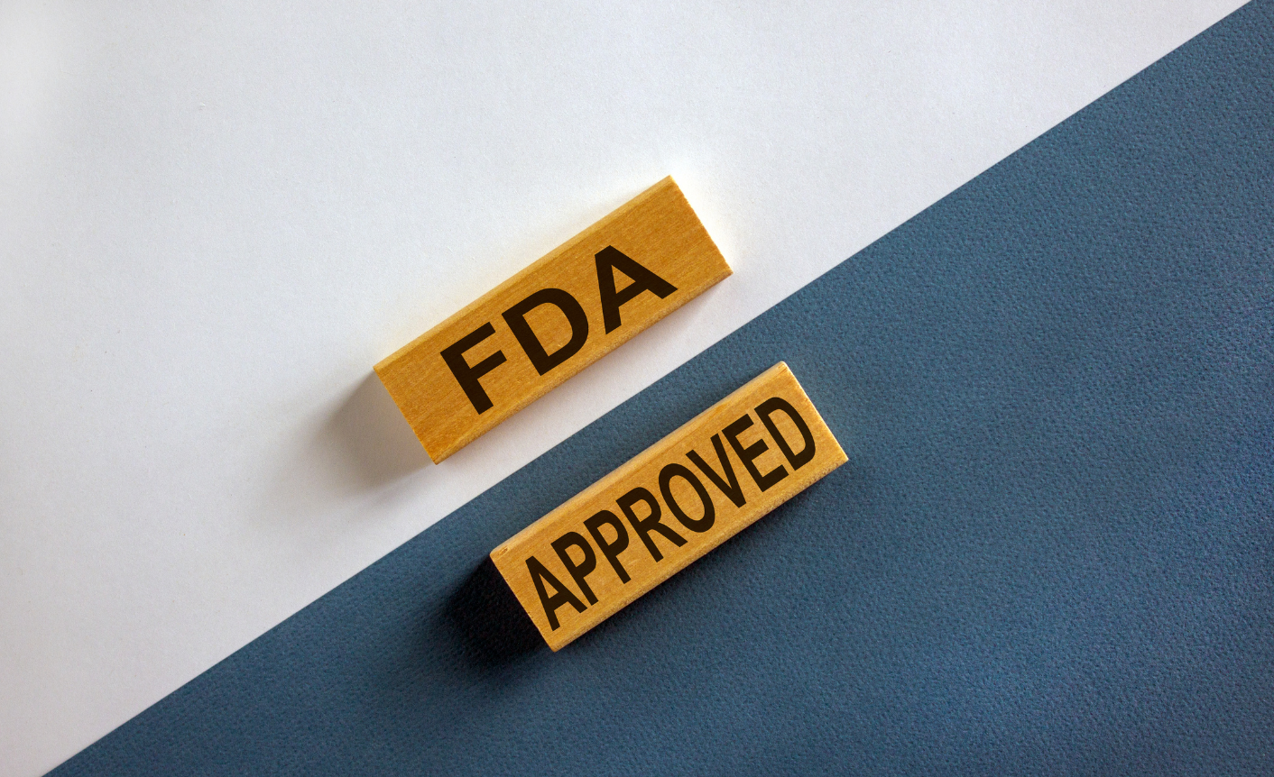Featured image that shows two wooden bricks on a black-white background with copy on them: "FDA APPROVED"