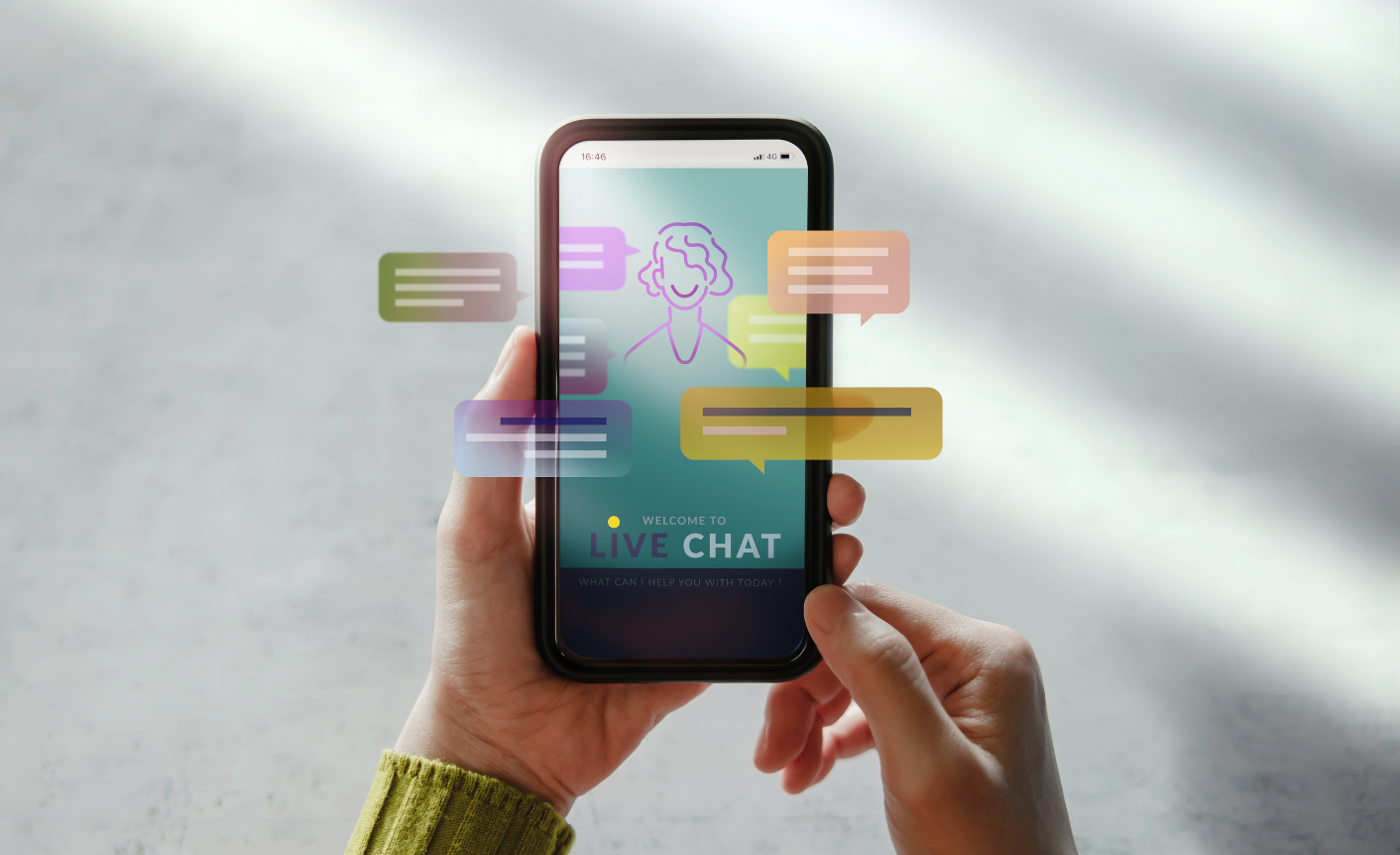 On a grey background is a mobile phone with different colored speech bubbles and a cartoon of a person to symbolize self-service content and its ability to reduce customer support calls.