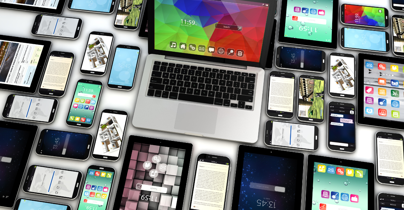 A collection of smart phones and laptops on a table