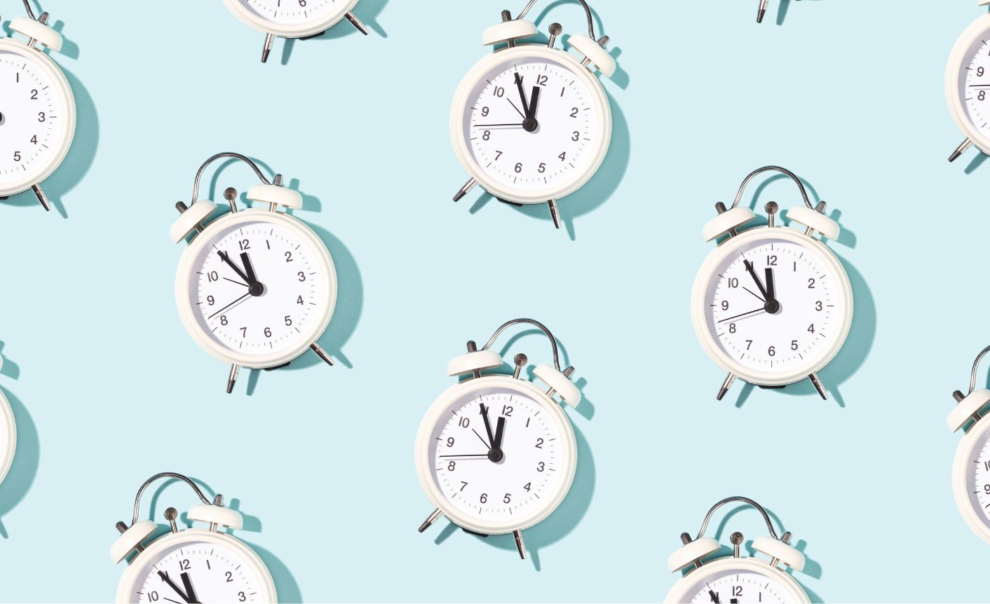 On a light blue background, lots of clocks are shown in a consistent pattern. They all show the time 11:55. They symbolize creating content faster.