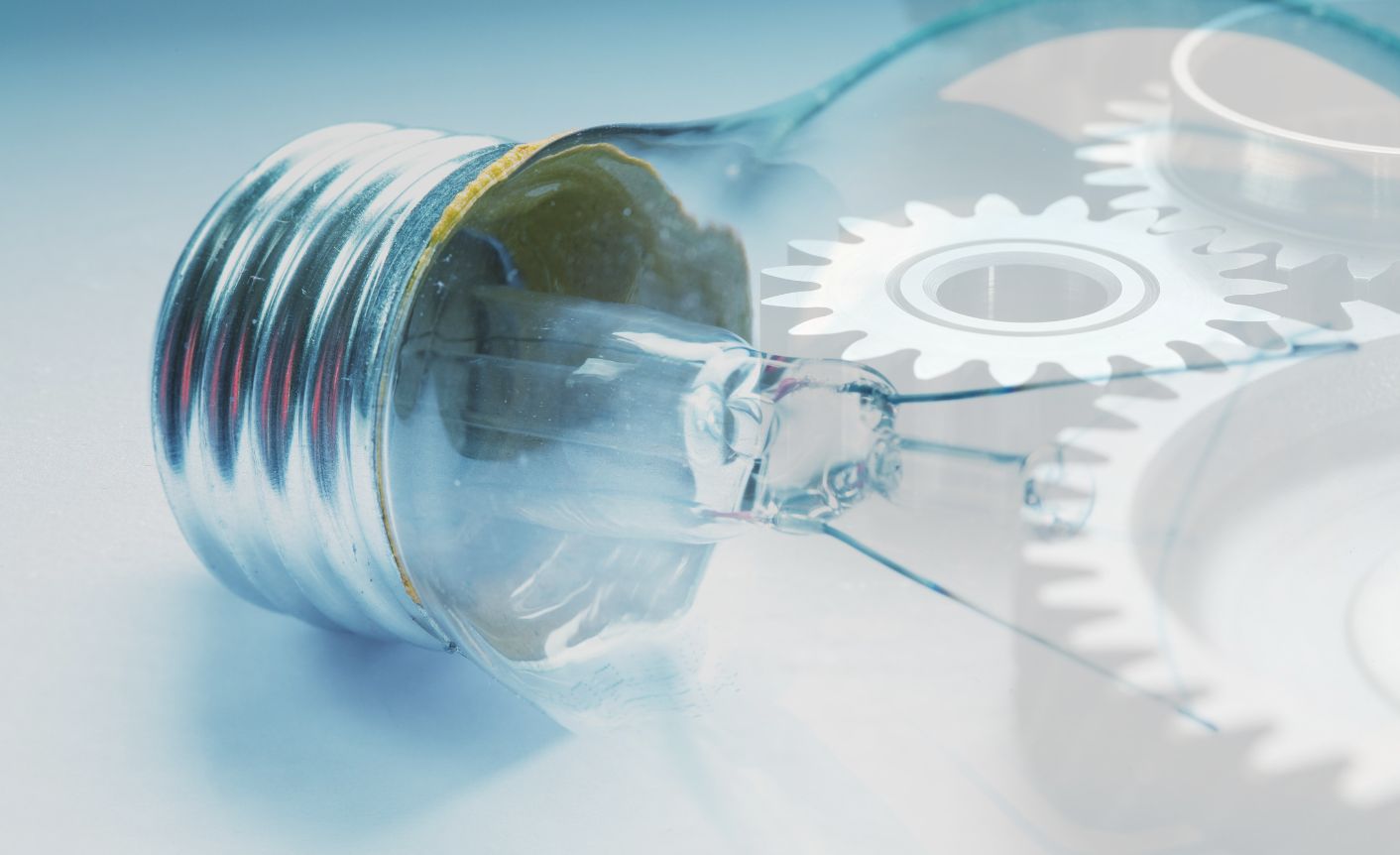 An overlay of a light bulb and gears symbolize clarity gains through automation.