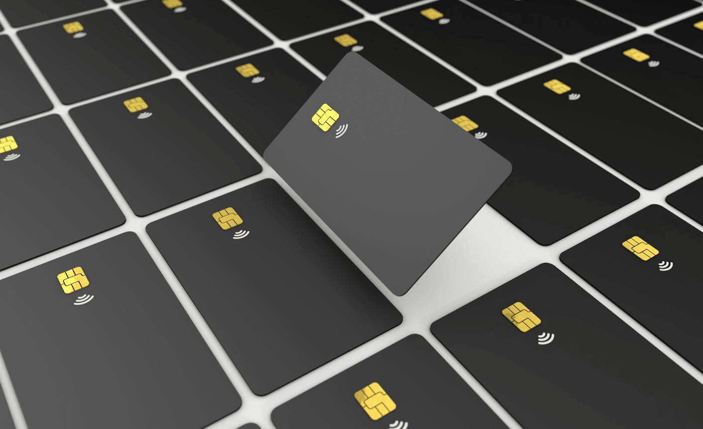 Aligning-banking-products-blog-image Numerous black credit cards with golden chips, one card angled and raised above the others.