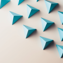 On a neutral background, blue triangular shapes are shown to symbolize consistent content.