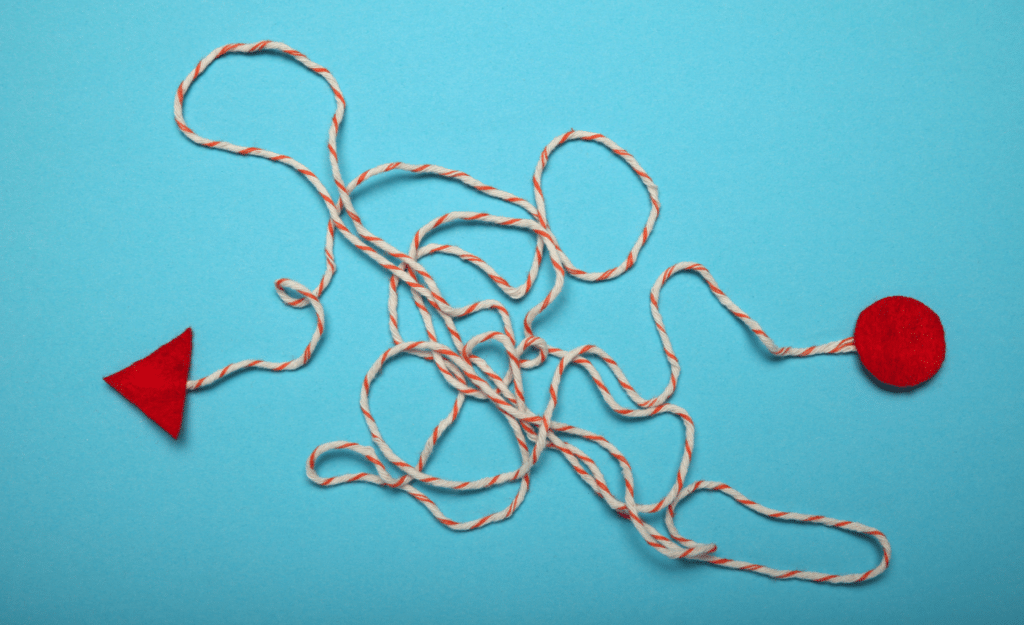 A messy line of string connecting two points that symbolizes why simple writing is superior to complex writing.