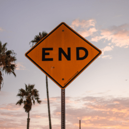 How is AI changing the world? The picture shows a traffic sign saying end representing fears of AI taking over the world.