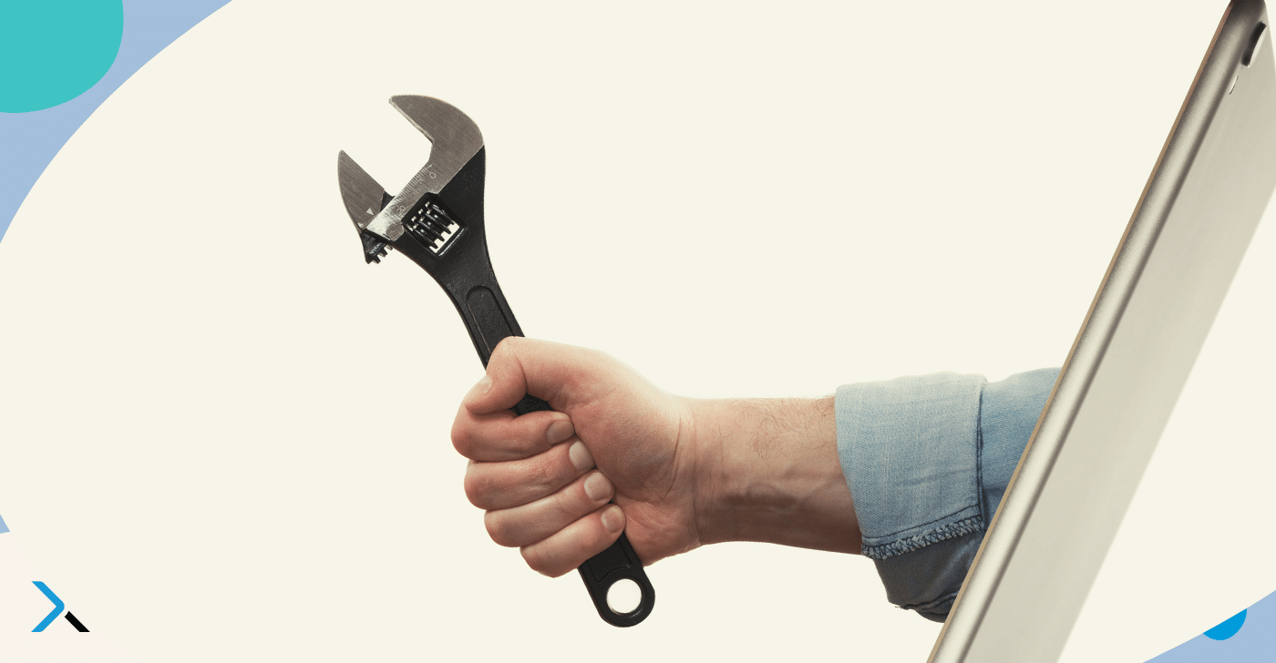 Technical writing checker blog A hand holding a wrench protruding from a screen symbolising a technical writing checker aimed at helping technical teams write better content.