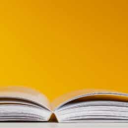 A yellow book symbolizes knowledge centered support content.